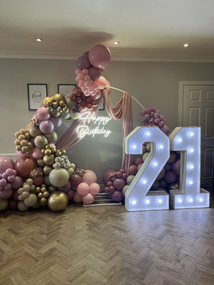 Balloons, drape, neon light, florals and 4ft LED numbers