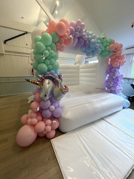 Unicorn themed bouncy castle