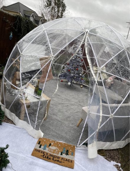 Christmas movie igloo with festive decorations and Christmas tree