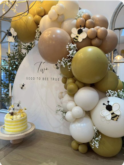Bee theme backdrop with balloon garland