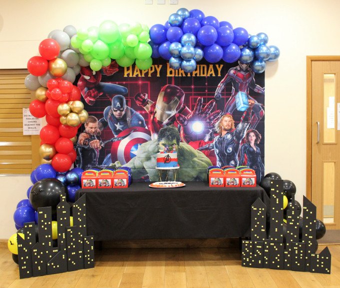 Marvel Superhero Balloon garland, backdrop and desert table with customised skyline.
