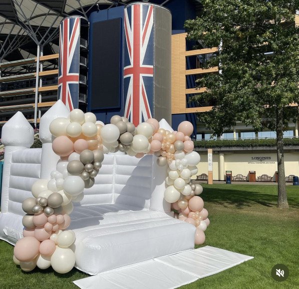White Bouncy Castle with Stunning Balloon Garland - Royal Ascot Racecourse