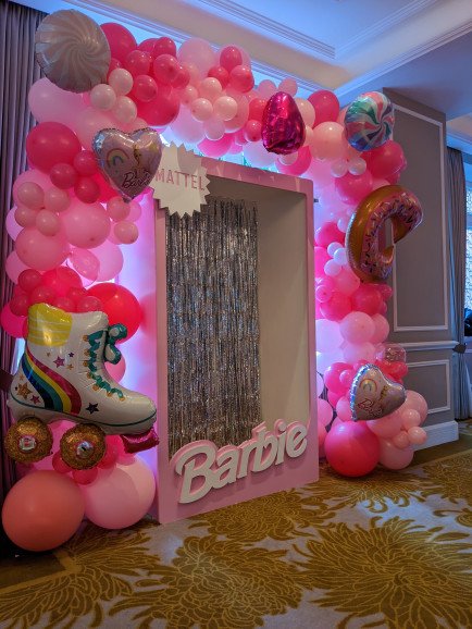 Barbie photo booth with deluxe balloon garland.