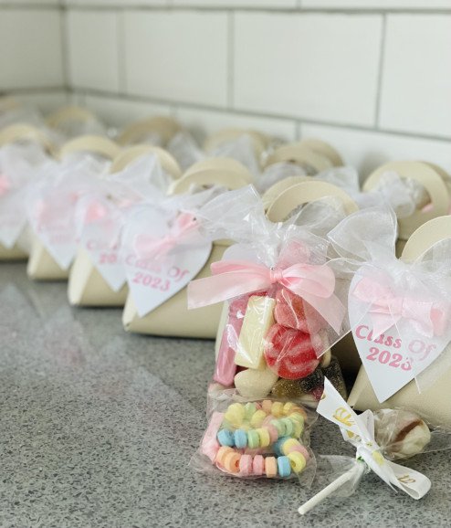Personalised prom bags filled with sweets.