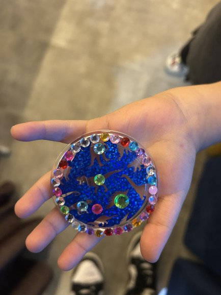Artwork design of another student of mine who designed his pin badge using my vinyl stencilled dinosaur and add decorated it with gems.